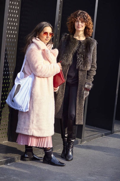 MILAN, ITALY - FEBRUARY 21: A fashionable couple is seen outside Gucci during Milan Fashion Week Fall/Winter 2018/19 on February 21, 2018 in Milan, Italy. - Photo, image