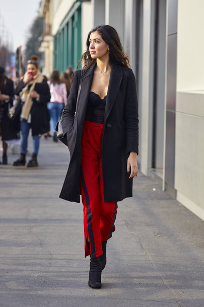 MILAN, ITALY - FEBRUARY 21: A fashionable person is seen outside Gucci during Milan Fashion Week Fall/Winter 2018/19 on February 21, 2018 in Milan, Italy. - Фото, зображення