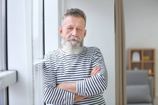 Portrait of mature man in casual clothes indoors - Fotoğraf, Görsel