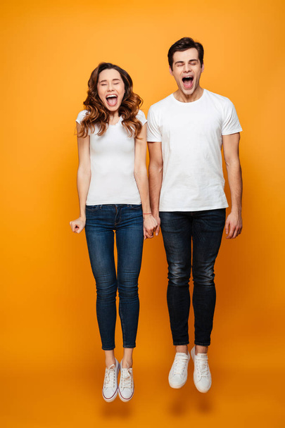 Full-length image of funny man and woman in casual posing on cam - Fotografie, Obrázek