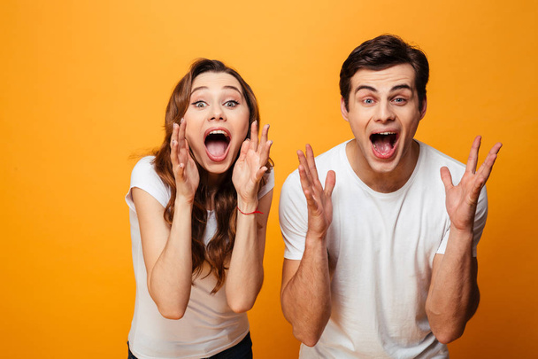 Portrait of a surprised young couple celebrating success - Foto, Bild