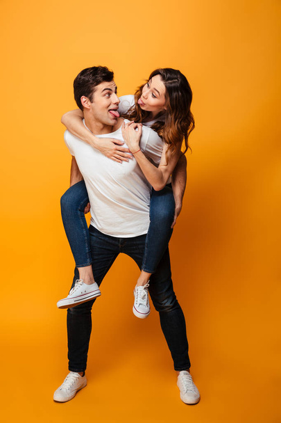 Full length image of Happy young lovely couple having fun - Foto, imagen