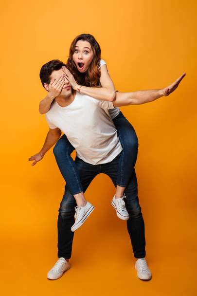 Full length image of Funny young lovely couple having fun - Fotografie, Obrázek