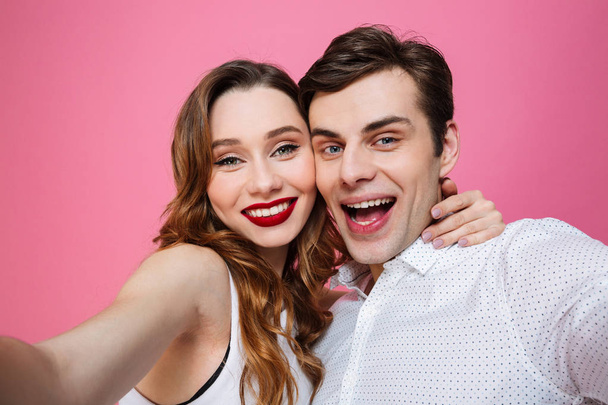 Portrait of a beautiful couple in love taking selfie - Valokuva, kuva