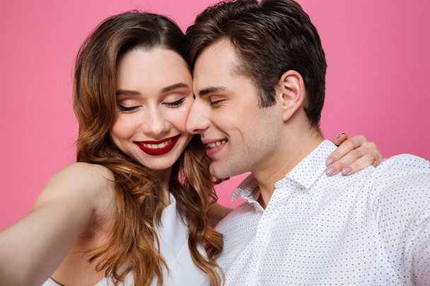 Portrait of young romantic man and woman hugging and enjoying ti - Foto, Imagen
