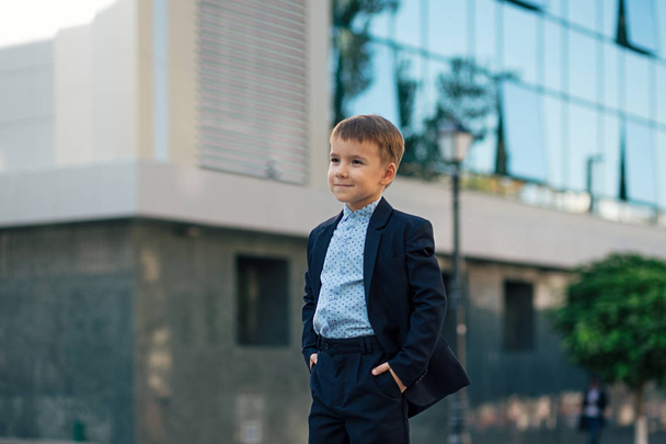 Boy in classic modern dark blue business costume  - Fotoğraf, Görsel