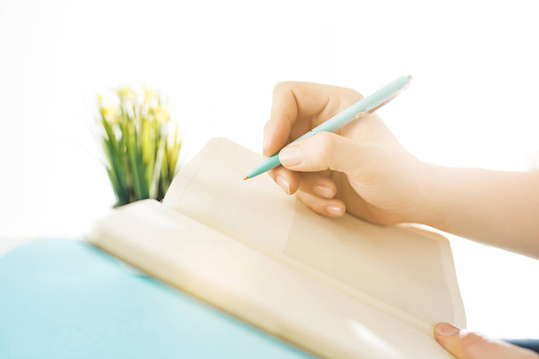 The male hands holding pen. The trendy blue desk. - Foto, imagen