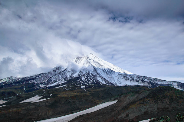 Mountain landscape: view on active Koryaksky Volcano on a sunny day. Koryaksky-Avachinsky Group of Volcanoes, Kamchatka Peninsula, Russia, Far East - Foto, afbeelding