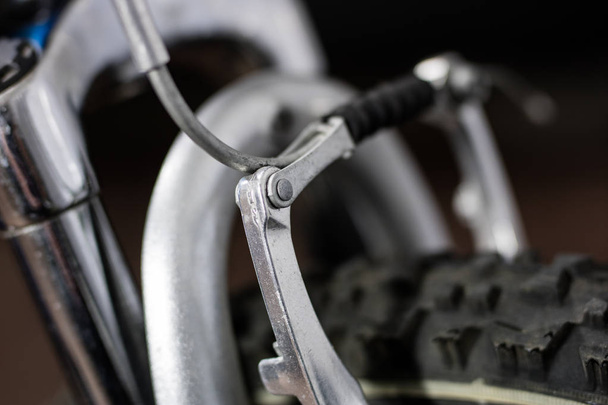 Kids bike. Shock absorber, brake, wheel shown close up. - Zdjęcie, obraz