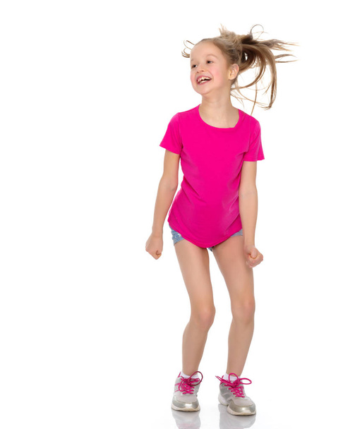 Girl gymnast jumping. - Zdjęcie, obraz