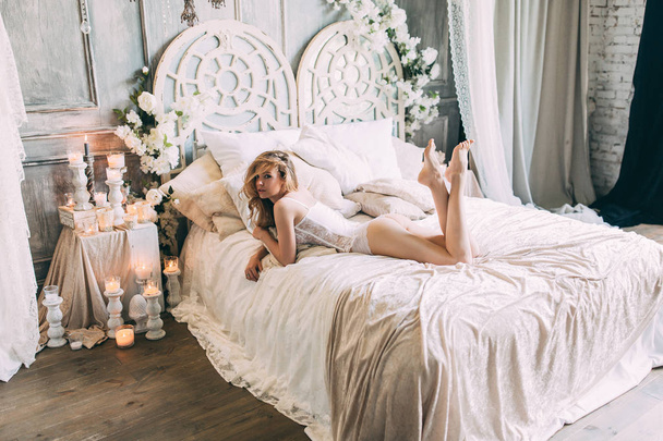 Beautiful boudoir morning of the bride on the bed. - Photo, Image