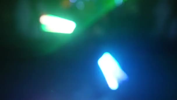African man shows a performance with fluorescent lights in a nightclub, blurred frame. - Footage, Video