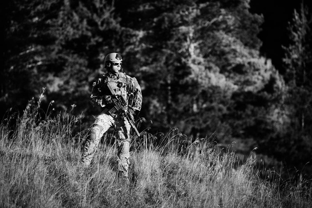 soldier of special forces in action pointing target and giving a - Valokuva, kuva