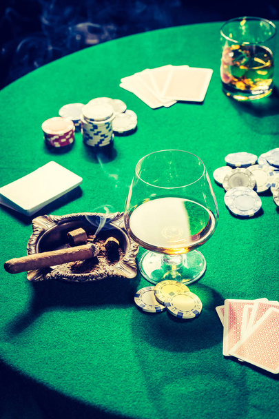 Old green table for poker with chips and cards - Foto, immagini