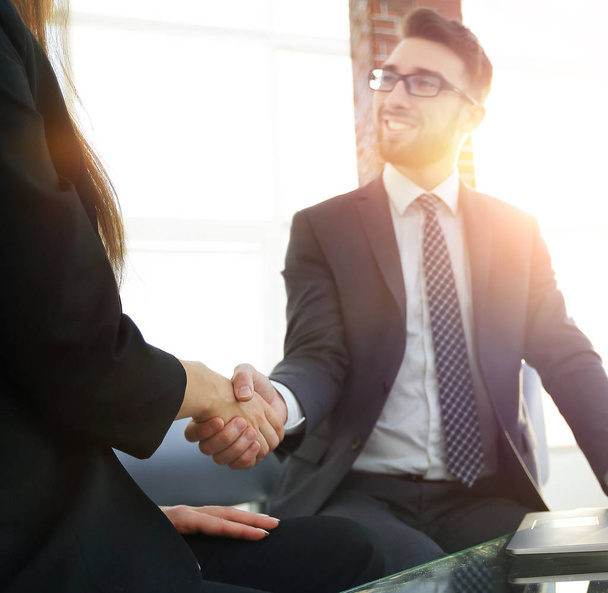 Successful businessmen handshaking after good deal. - Foto, afbeelding