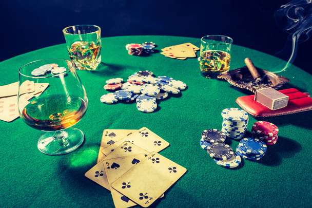 Whiskey, cigar and cards in old green table for poker - Zdjęcie, obraz