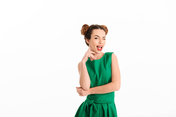 Cheerful ginger woman in green dress posing - Photo, image