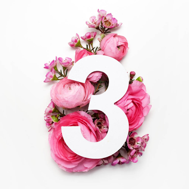 Layout with colorful flowers, leaves and number three. Flat lay. Top view. - Foto, Bild