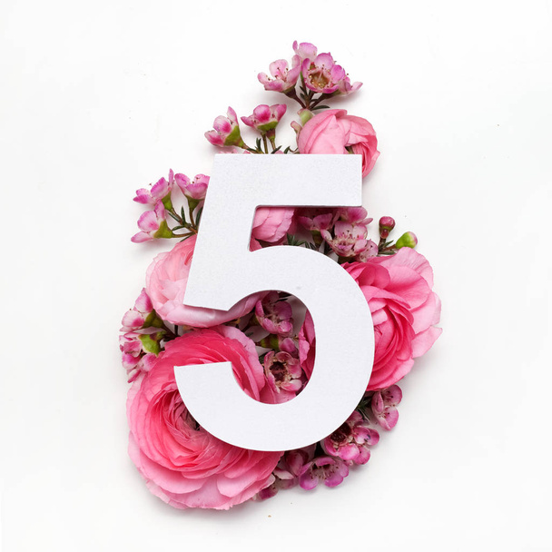 Layout with colorful flowers, leaves and number five. Flat lay. Top view. - Valokuva, kuva
