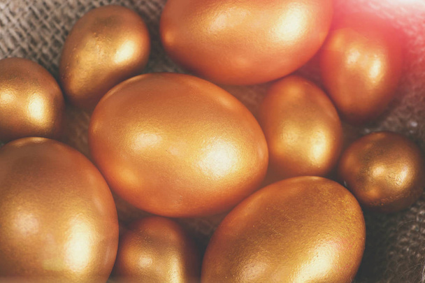 traditional golden eggs, happy easter holiday celebration - Foto, Imagen