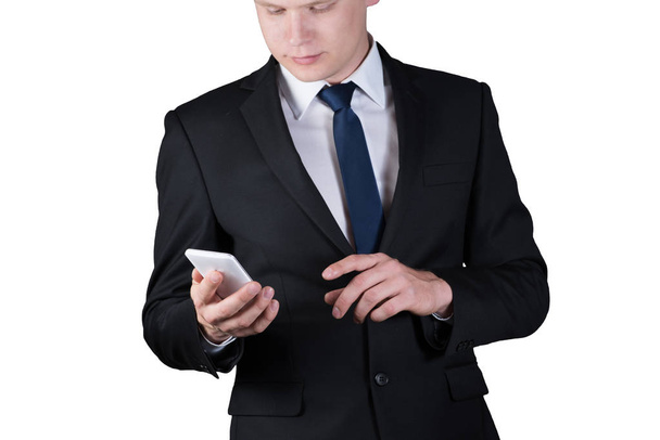fiatal üzletember gazdaság egy mozgatható telefon, elszigetelt fehér background - Fotó, kép