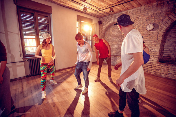 young hip hop dancers dancing in the studio. Sport, dancing  - Fotó, kép
