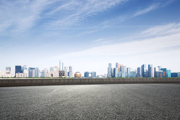 empty asphalt road and cityscape of Hangzhou Qianjiang new city in blue cloud sky - Photo, Image