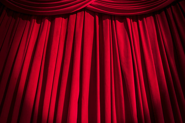Red curtain theater background with folds, shadows and highlights. - Photo, Image