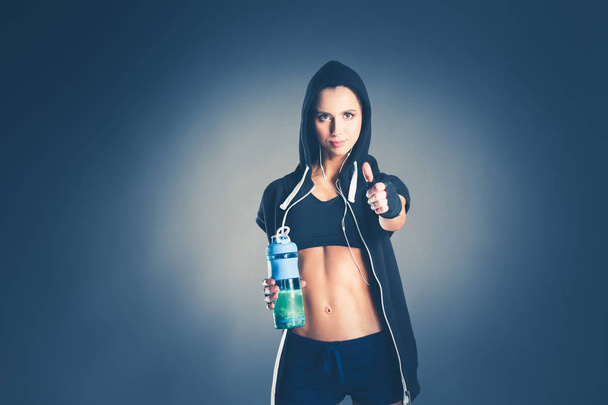 Girl with bottle in hands after sport. - Foto, Imagem