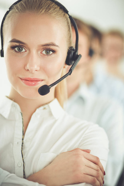 Attractive positive young businesspeople and colleagues in a call center office. Businesspeople - Foto, Imagem