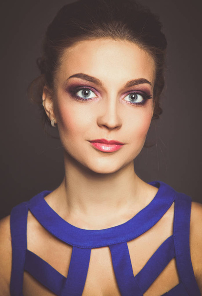 Studio shot of a beautiful young woman wearing professional makeup. - Photo, Image