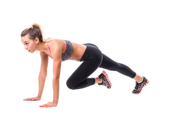 Tan Skin Fitness Girl in Sport Exercise warm up in white studio room, practice pose abs power planking on floor - Fotó, kép
