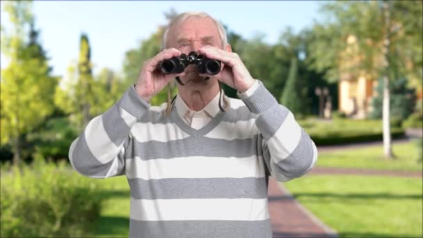 Man with binoculars, nature background. - Footage, Video