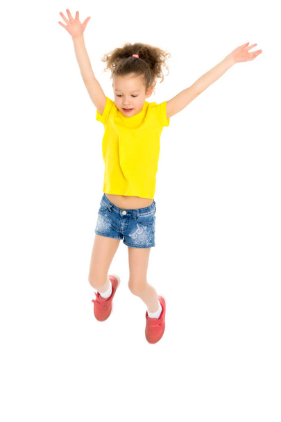 Little girl is jumping. - Фото, изображение