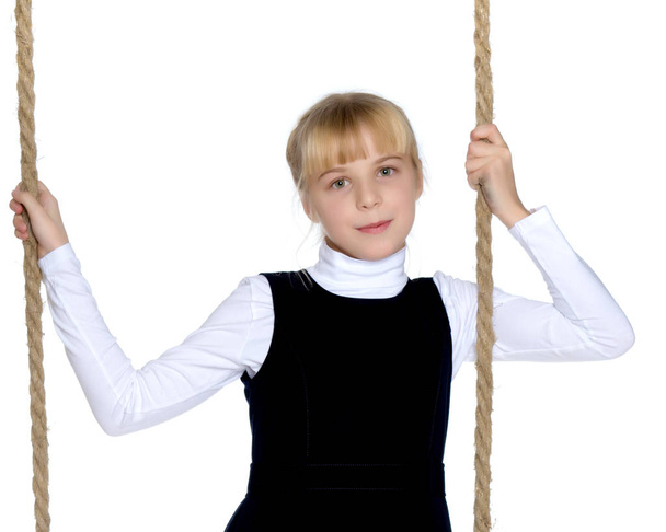 Little girl swinging on a swing - Zdjęcie, obraz
