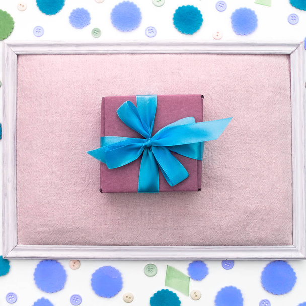 Gift box on festive pastel background. - Photo, Image