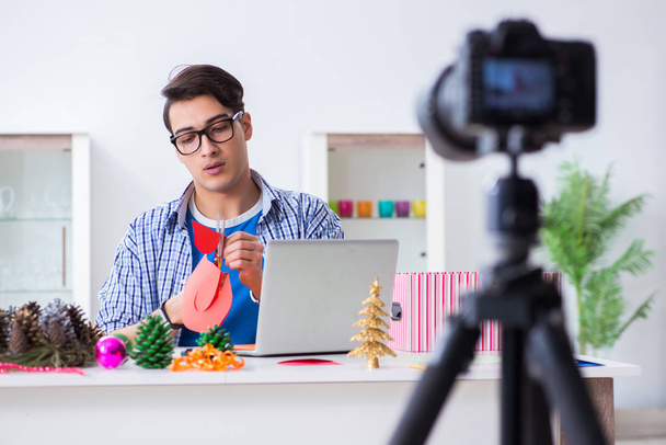 Video blogger recording making paper decoration - Photo, Image