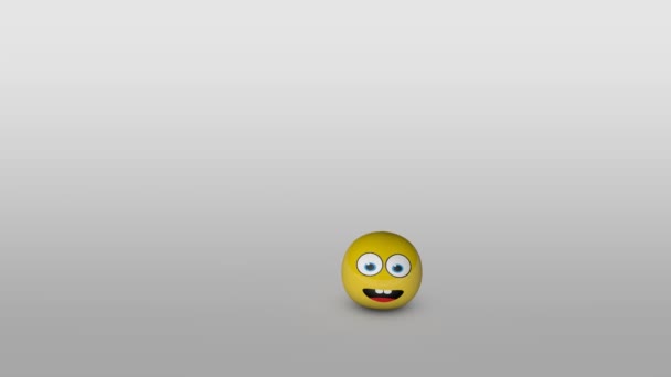 Kreskówka żółty, odbijając piłkę z uśmiechniętą twarz, odbijając się i rozrasta się na powierzchnię szary gradientu. - Materiał filmowy, wideo
