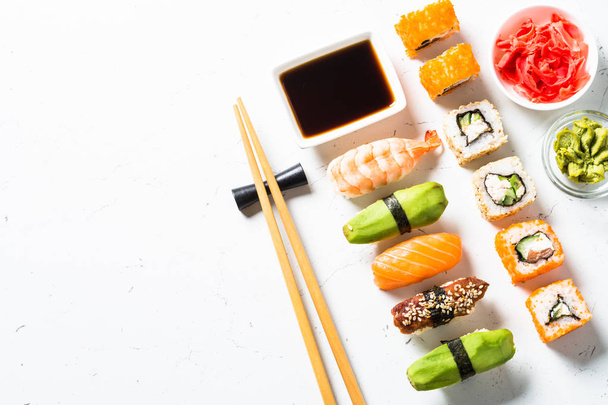 Sushi and sushi roll set on white background. - Valokuva, kuva