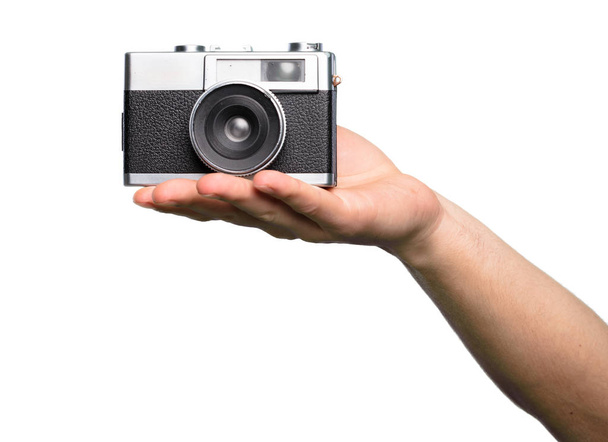 Hand holding Camera over isolated white background - Photo, Image