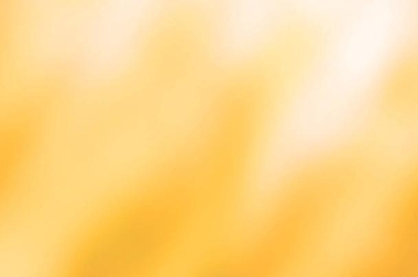 πορτοκαλί και κίτρινο χρυσό αφηρημένη κίνηση θάμπωμα φόντου. - Φωτογραφία, εικόνα