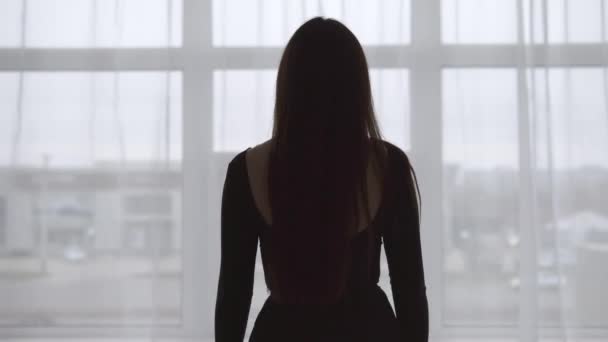 Young model looking out of window - Video, Çekim