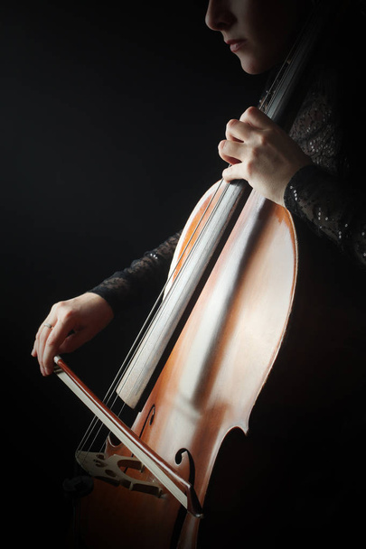 Cello player. Cellist hands playing violoncello with bow - Fotó, kép