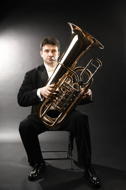 Tuba player brass instrument. Classical musician portrait - Foto, Imagen