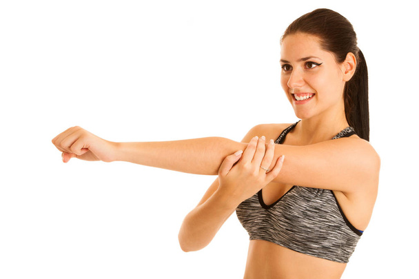 active young fit woman stretching arm isolated over white backgr - Fotoğraf, Görsel