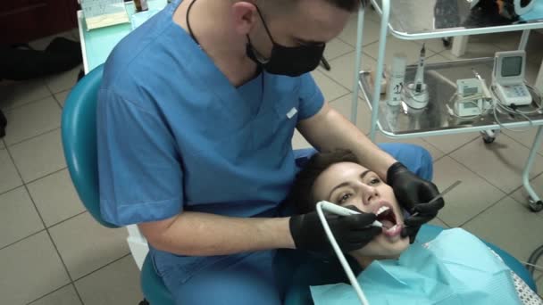 Dentist Make A Checkup And Dental Cleaning For A Young Woman - Felvétel, videó