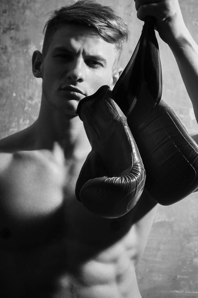 boxing gloves in strong hand of man - Photo, Image