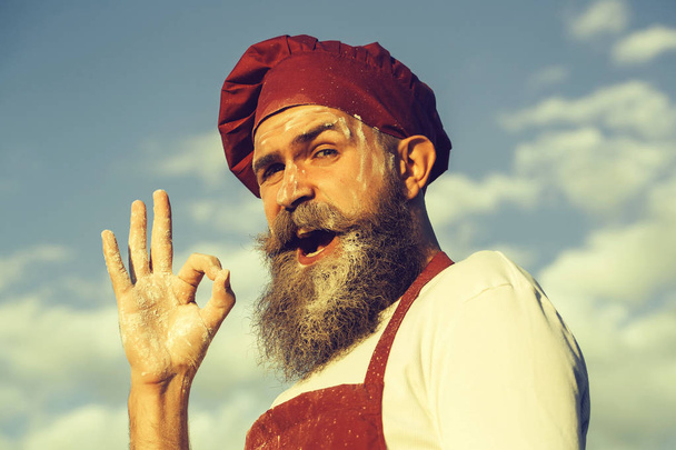 bearded man cook in red hat - Foto, Imagem