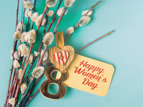 Happy International Womens Day celebrate on March 8, congratulatory CARD. rose-color paper hearts shape figure eight 8 on blue background  - Zdjęcie, obraz