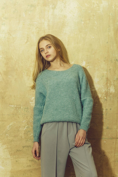 Pretty young girl with blond hair in fashionable sweater, culott - Foto, afbeelding
